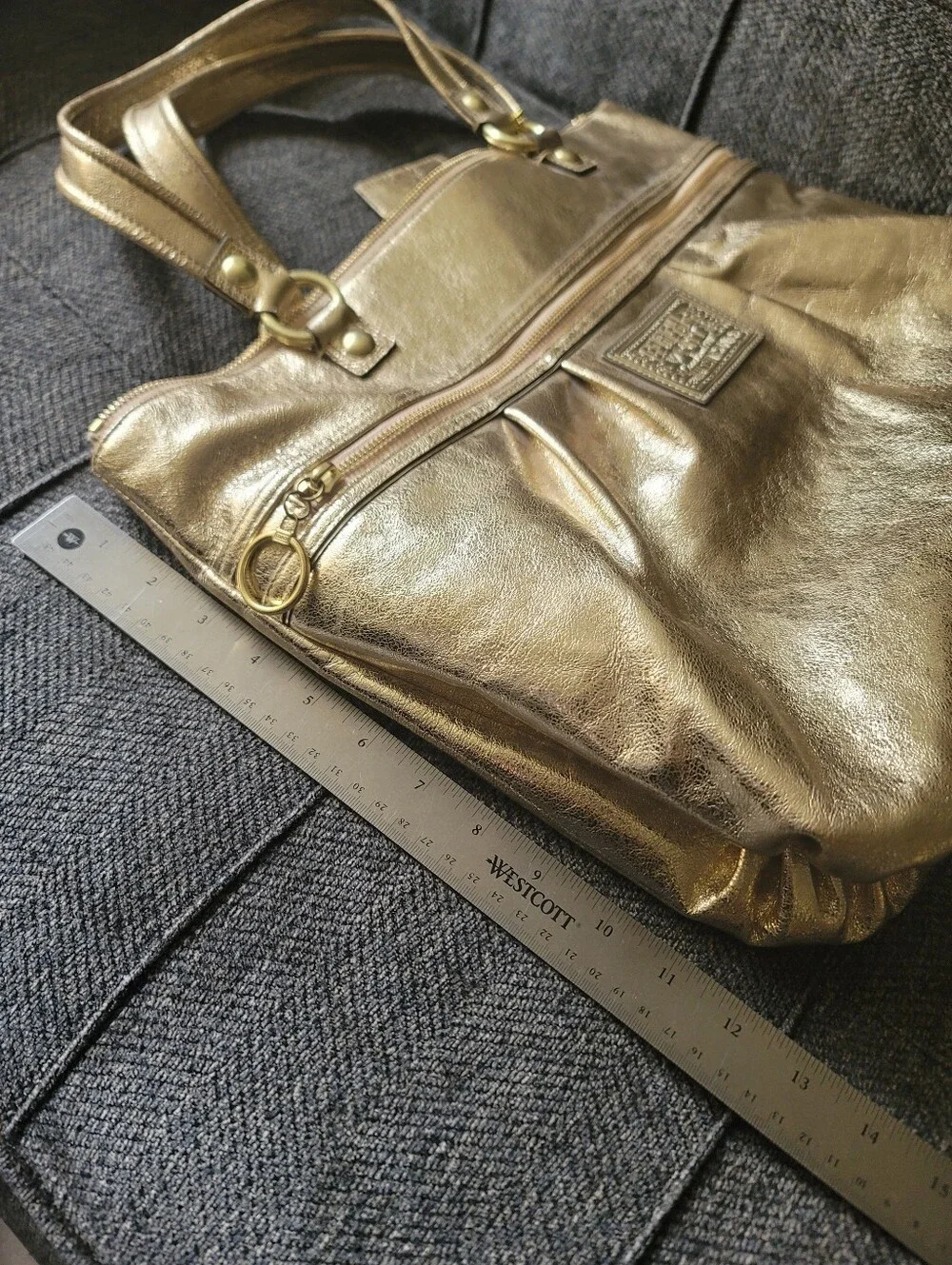Coach Poppy Metallic Gold Leather Tote With Cursive Coach Charm